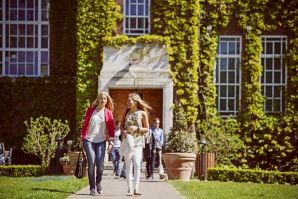 Students walking in front of the University entrance