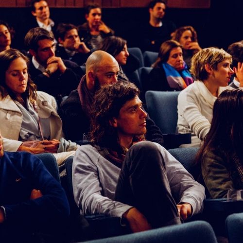 Students listening in lecture theatre